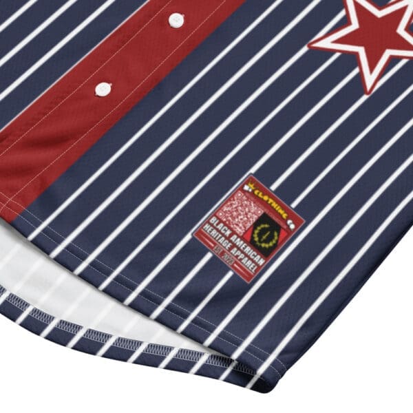 Detailed view of the stitching on the red fabric of the Negro League replica jersey.