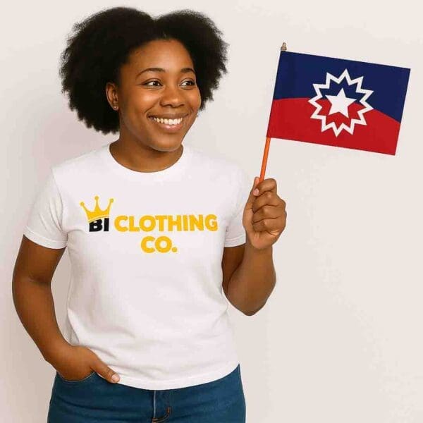 Smiling woman wearing B1 Clothing Co. t-shirt proudly holding the Juneteenth hand flag for celebration.