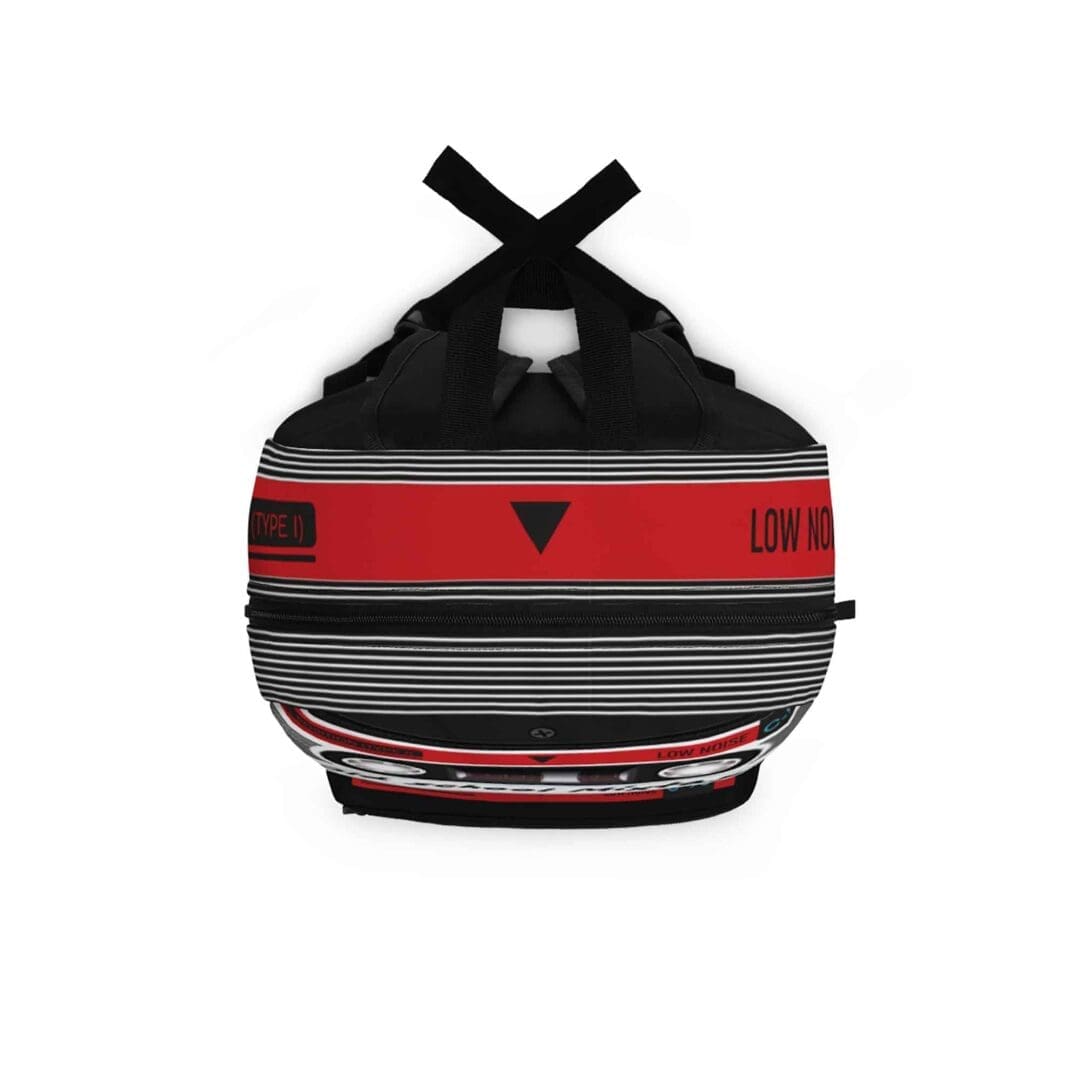 Top-down view of the vintage grunge backpack, displaying the black top handle, adjustable straps, and the top portion of the 90s mixtape design.